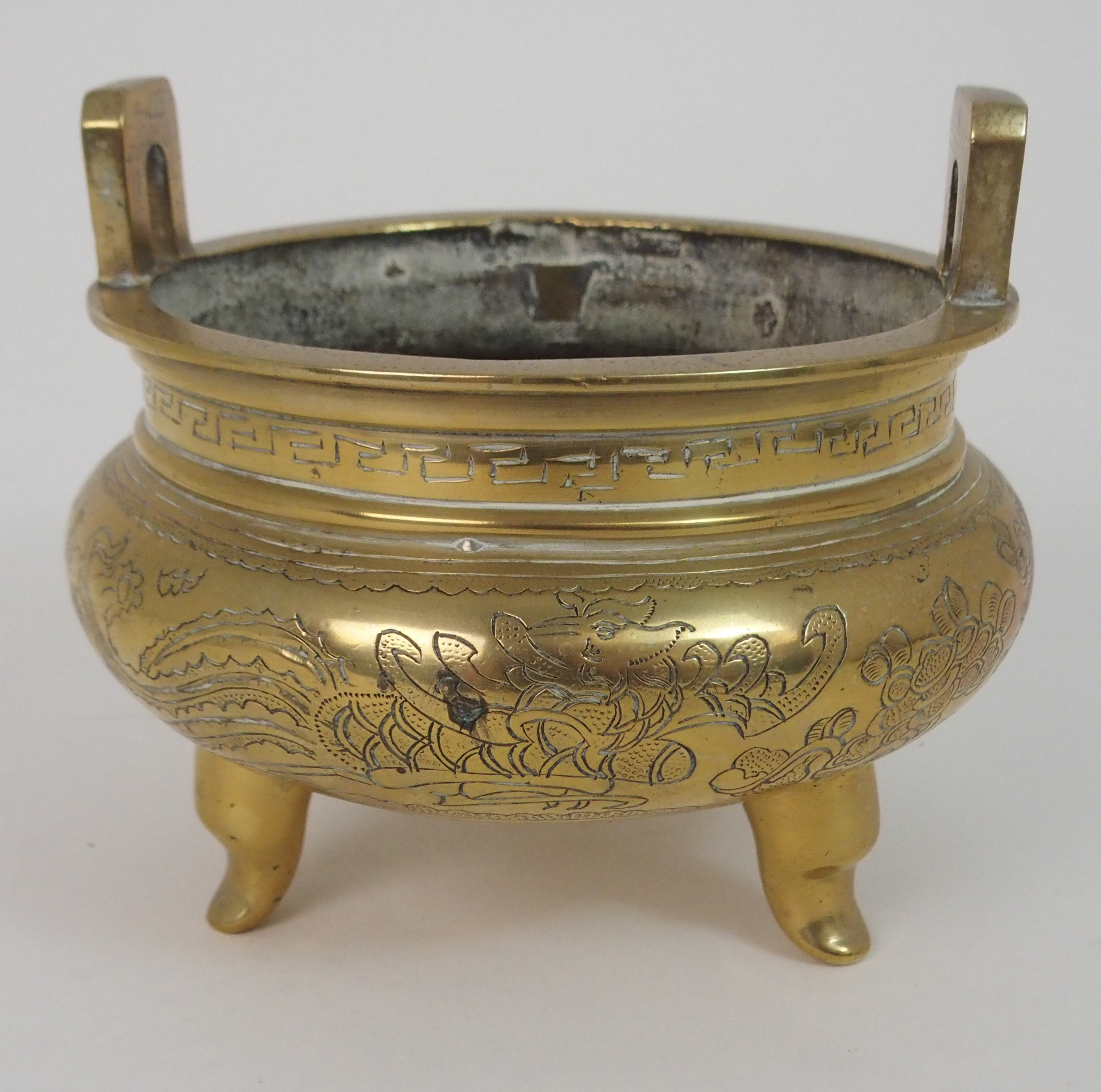 A CHINESE BRASS INCENSE BURNER with lug handles above a key pattern band and decorated with precious - Image 3 of 6