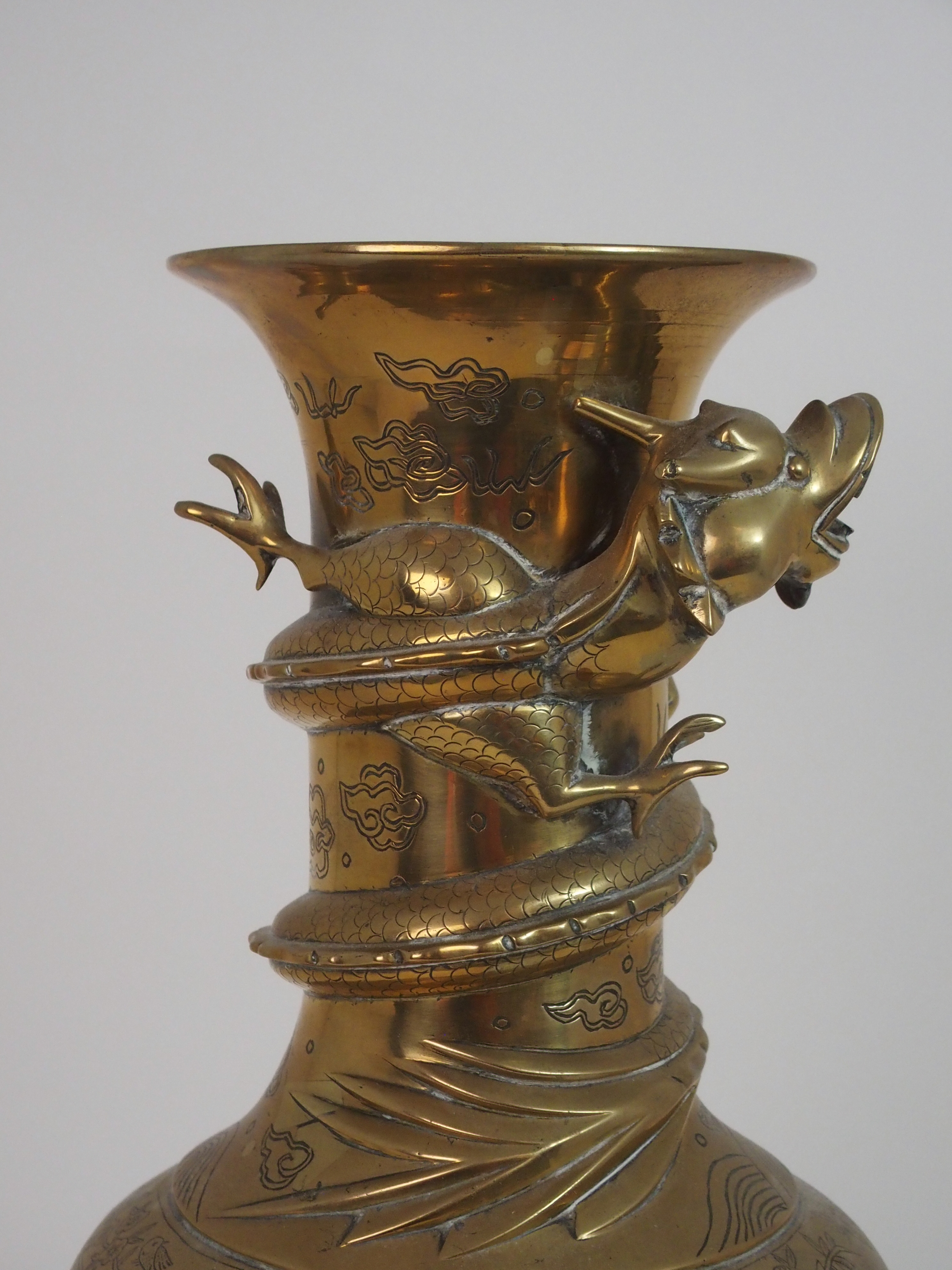 A CHINESE BRASS BALUSTER VASE cast with a dtragon wraped around the neck and above panels of dragons - Image 2 of 8