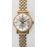 A 9CT GOLD GENTS TISSOT SEASTAR SEVEN WRISTWATCH with silvered dial, gold baton numerals and