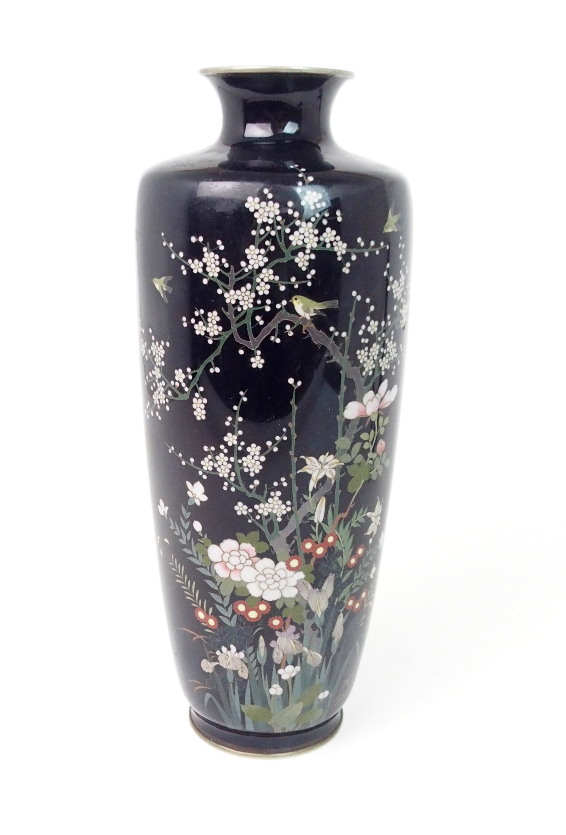 A JAPANESE CLOISONNE BALUSTER VASE decorated with birds on blossoming branches and over garden