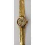 A LADIES 14K GOLD HABMANN WRISTWATCH with cream coloured dial, Arabic and baton numerals and gold