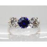 AN 18CT WHITE GOLD FAUX SAPPHIRE AND DIAMOND RING the diamonds together weight in at 1.20cts