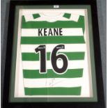 A GREEN AND WHITE REPLICA CELTIC SHIRT No.16, the reverse lettered Keane, also autographed by Roy