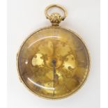 AN 18CT GOLD OPEN FACE POCKET WATCH with decorative gold coloured dial, Arabic numerals,