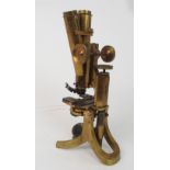 A VICTORIAN BRASS MICROSCOPE BY J SWIFT AND SON the foot stamped J. Swift & Son, Tottenham Court Rd,