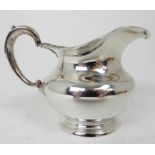 A RUSSIAN SILVER CREAM JUG marked 84 and AM, possibly Andreas Makkonnen, St. Petersburg 1858, of