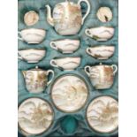 A SATSUMA CASED TEA SET painted with female figures before rivers in a mountainous landscape,