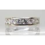 AN 18CT WHITE GOLD DIAMOND HALF ETERNITY RING set with estimated approximately 1ct of brilliant