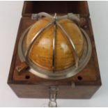 A LATE 20TH CENTURY RUSSIAN CELESTIAL GLOBE in oak case, 24cm wide Condition Report: Available