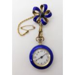 A SILVER GILT ENAMELLED FOB WATCH with white enamelled dial, gold dot markers with black Arabic