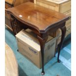 A mahogany fold over card table Condition Report: Available upon request