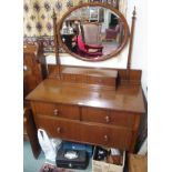 A walnut dressing chest with oval mirror Condition Report: Available upon request