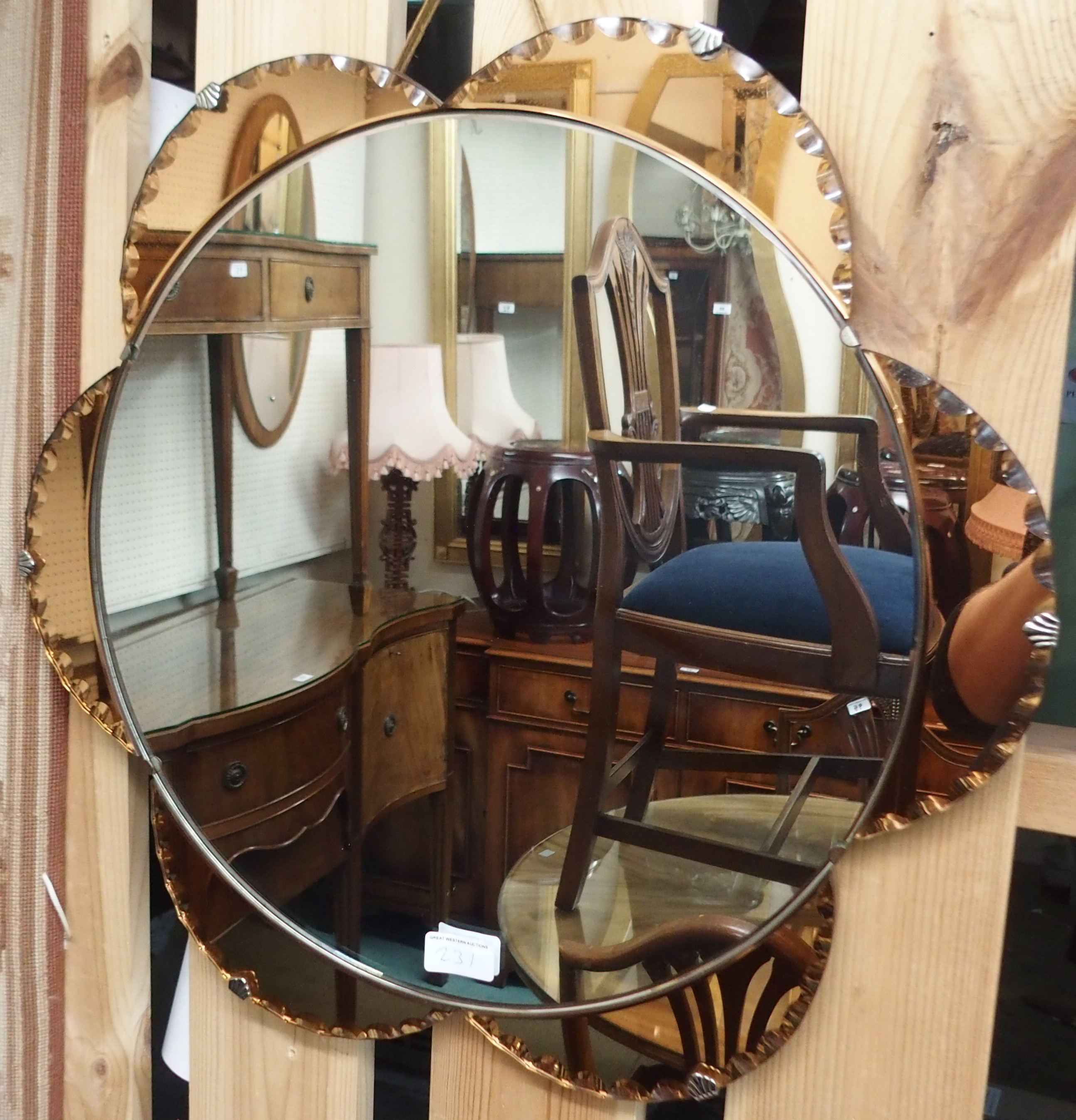 A frameless mirror, 56cm diameter Condition Report: Available upon request