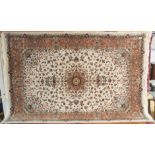 A fine woven full pile rug with floral medallion design and unique terracotta border, 150cm x