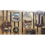 A brass circular wall mirror with bevelled glass, three other wall mirrors, picture and a pair of