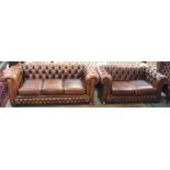 A tan leather three seater sofa, 72cm high x 190cm wide, a matching two seater sofa, 72cm high x