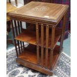 An inlaid mahogany revolving bookcase, 80cm high Condition Report: Available upon request