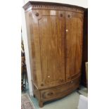 A mahogany bow front wardrobe with two doors over single drawer, 207cm high x 135cm wide x 60cm deep