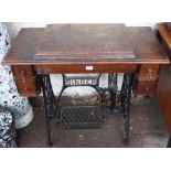 A Singer treadle sewing machine Condition Report: Available upon request