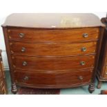 A Victorian mahogany inlaid bow front four drawer chest with column supports, 102cm high x 120cm