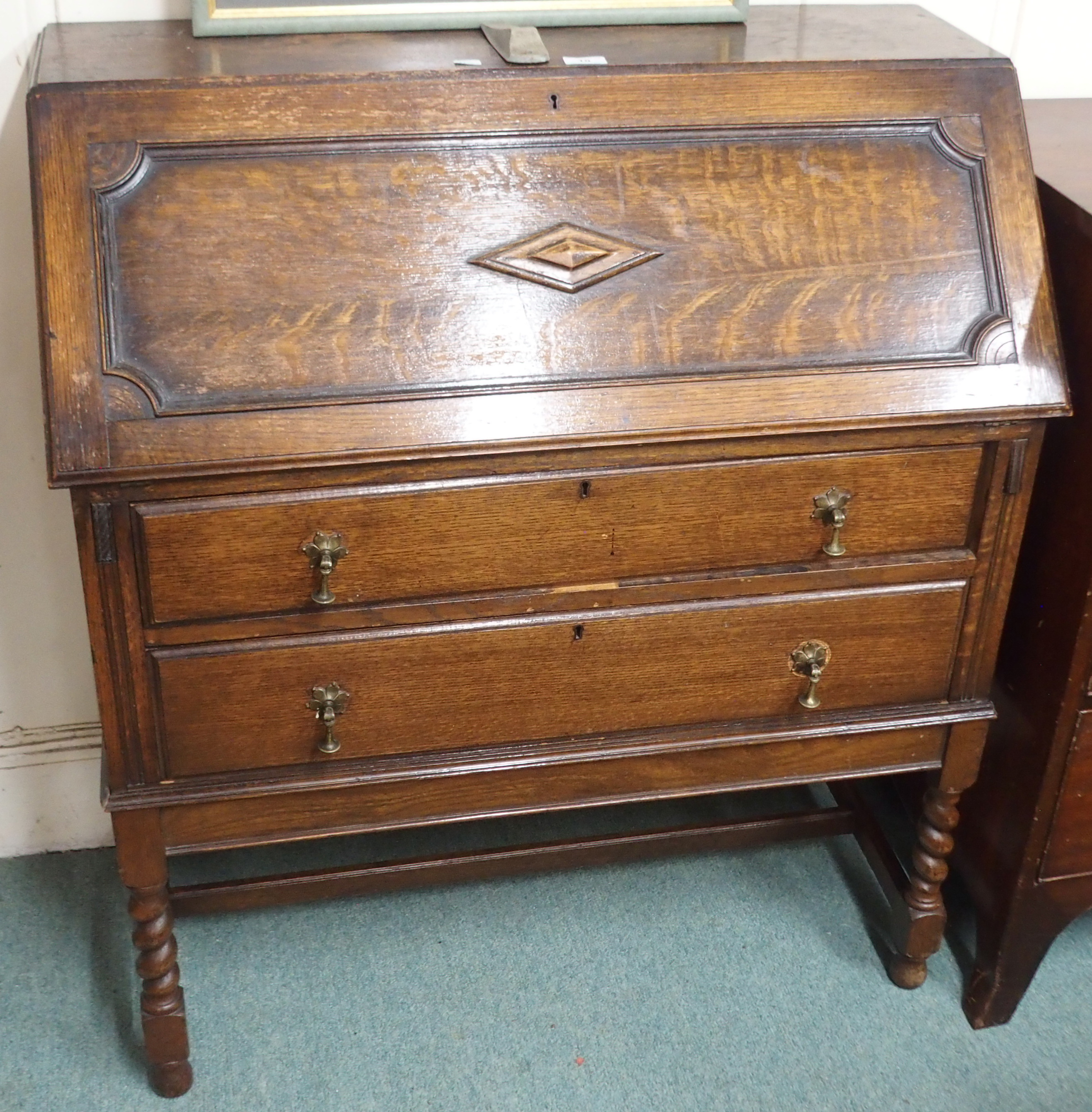 An oak bureau with barley twist supports, 103cm high x 92cm wide x 45cm deep Condition Report: