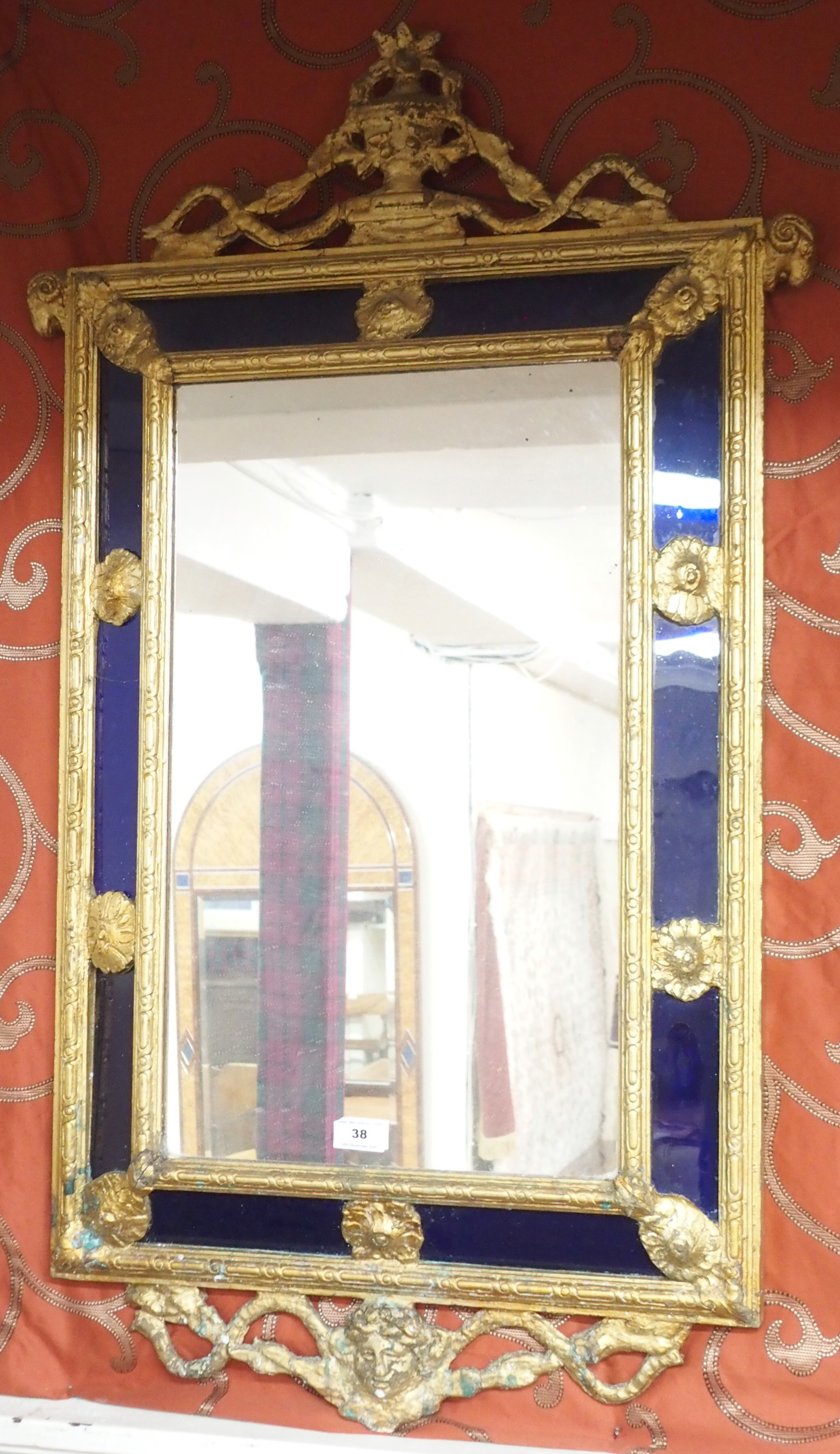 A gilt framed mirror with blue glass panels, 104cm high x 54cm wide Condition Report: Available upon