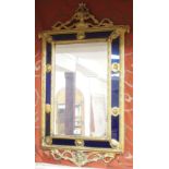 A gilt framed mirror with blue glass panels, 104cm high x 54cm wide Condition Report: Available upon