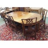 A mahogany extending D-end dining table, 73cm high x 234cm wide x 112cm deep with six Chippendale