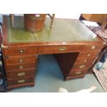 A reproduction mahogany campaign style pedestal desk with leather skiver, 75cm high x 122cm wide x