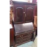 A mahogany bureau cabinet top on an associated base with two over three drawers, 192cm high x 96cm