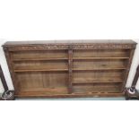 A Victorian carved oak open bookcase, 123cm high x 240cm wide x 25cm deep Condition Report: