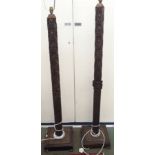 A pair of heavily carved mahogany standard lamps (2) Condition Report: Available upon request