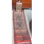 A red ground Eastern Runner fragment with geometric design, 172cm x 59cm and a Georgian style