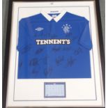 A blue Rangers replica short-sleeved shirt, the front bearing numerous player autographs from the