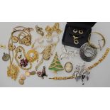 A retro Limit pendant watch, a Christmas tree brooch, a Trifari brooch and other items of vintage