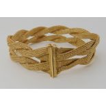 An 18ct gold knitted mesh style chain bracelet, length 19.5cm, weight 31.6gms Condition Report: This