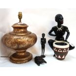 A plaster figure of a woman, two wooden tribal figures and a pottery table lamp Condition Report: