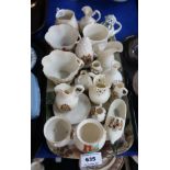 A collection of crested Nautilus porcelain including jugs, cups, cauldron's etc Condition Report: