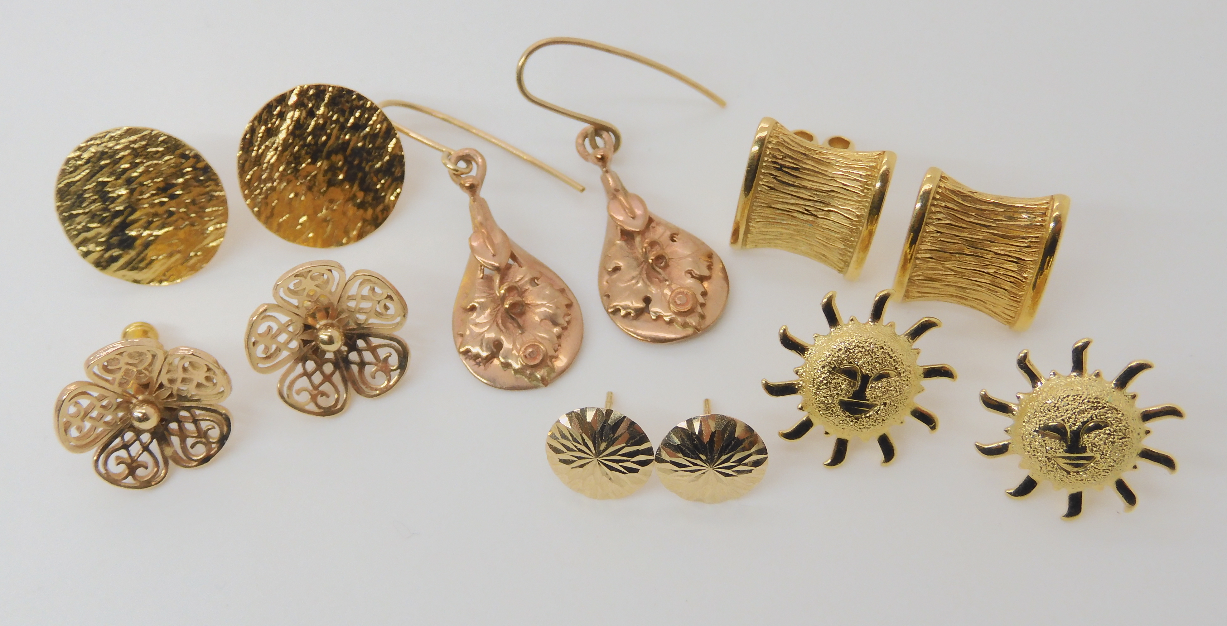 A collection of six pairs of 9ct and yellow metal earrings, approximate weight 14gms Condition