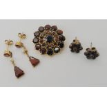 A 9ct gold garnet cluster brooch, together with a pair of 9ct garnet and pearl drop earrings and a