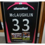 A black and pink Partick Thistle shirt No.33, lettered McLaughlin and autographed by Neil