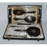 A cased seven piece silver and tortoiseshell dressing table set, Birmingham 1923 Condition Report: