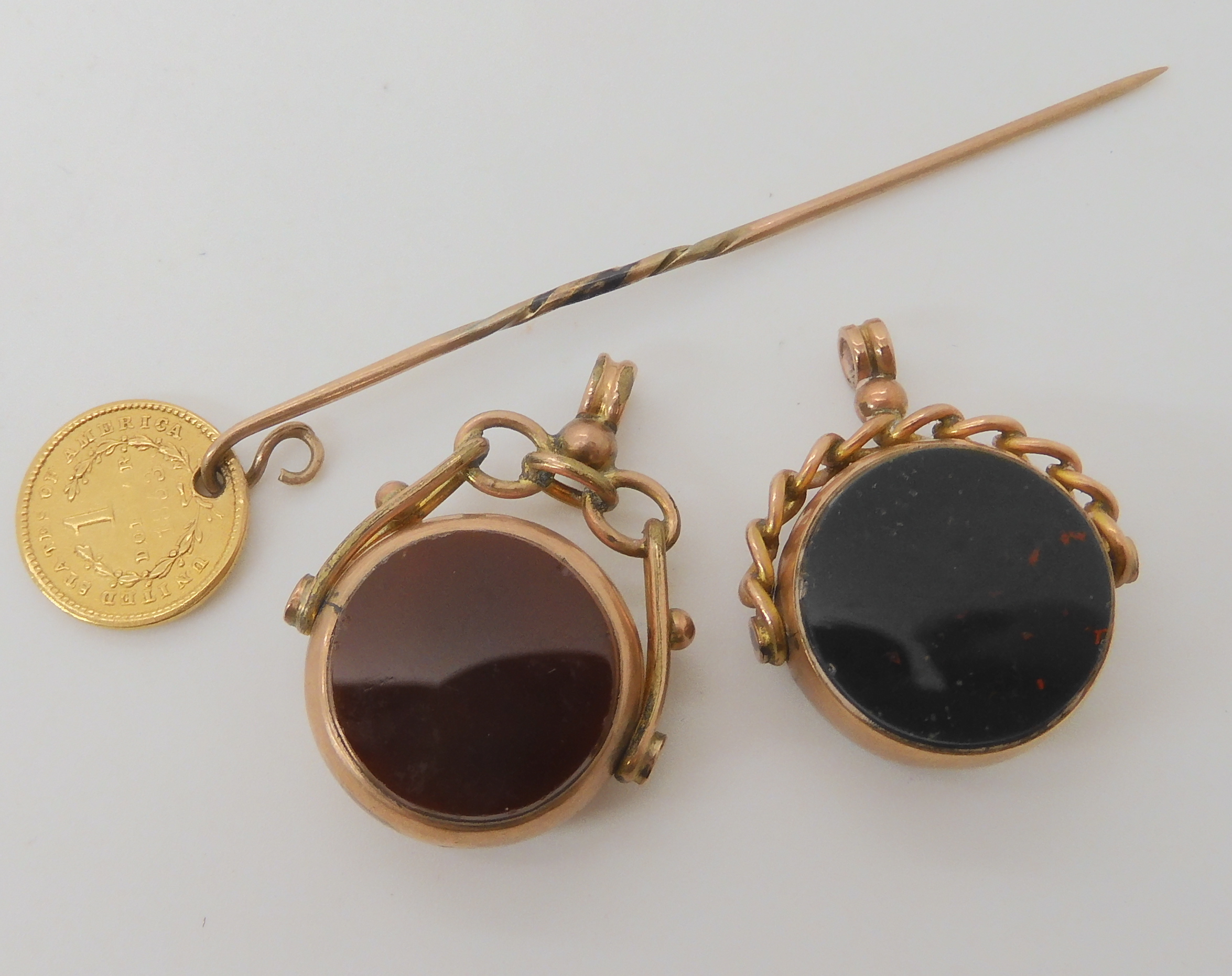 Two 9ct gold double sided agate fob seals, and a stick pin with an attached 1853 1 dollar USA - Image 3 of 3