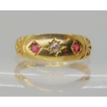 An 18ct gold diamond and red gem set ring, hallmarked Chester 1898, size O, weight 3gms Condition