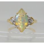 A 9ct gold Ethiopian marquis shaped opal and diamond ring, size O, weight 2.6gms Condition Report: