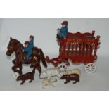 A vintage cast-iron Overland Circus horse drawn wagon with figures and bears, 40cm long overall