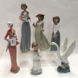 Six Nao figures including a lady holding a kitten, a swan etc Condition Report: girl holding bunch