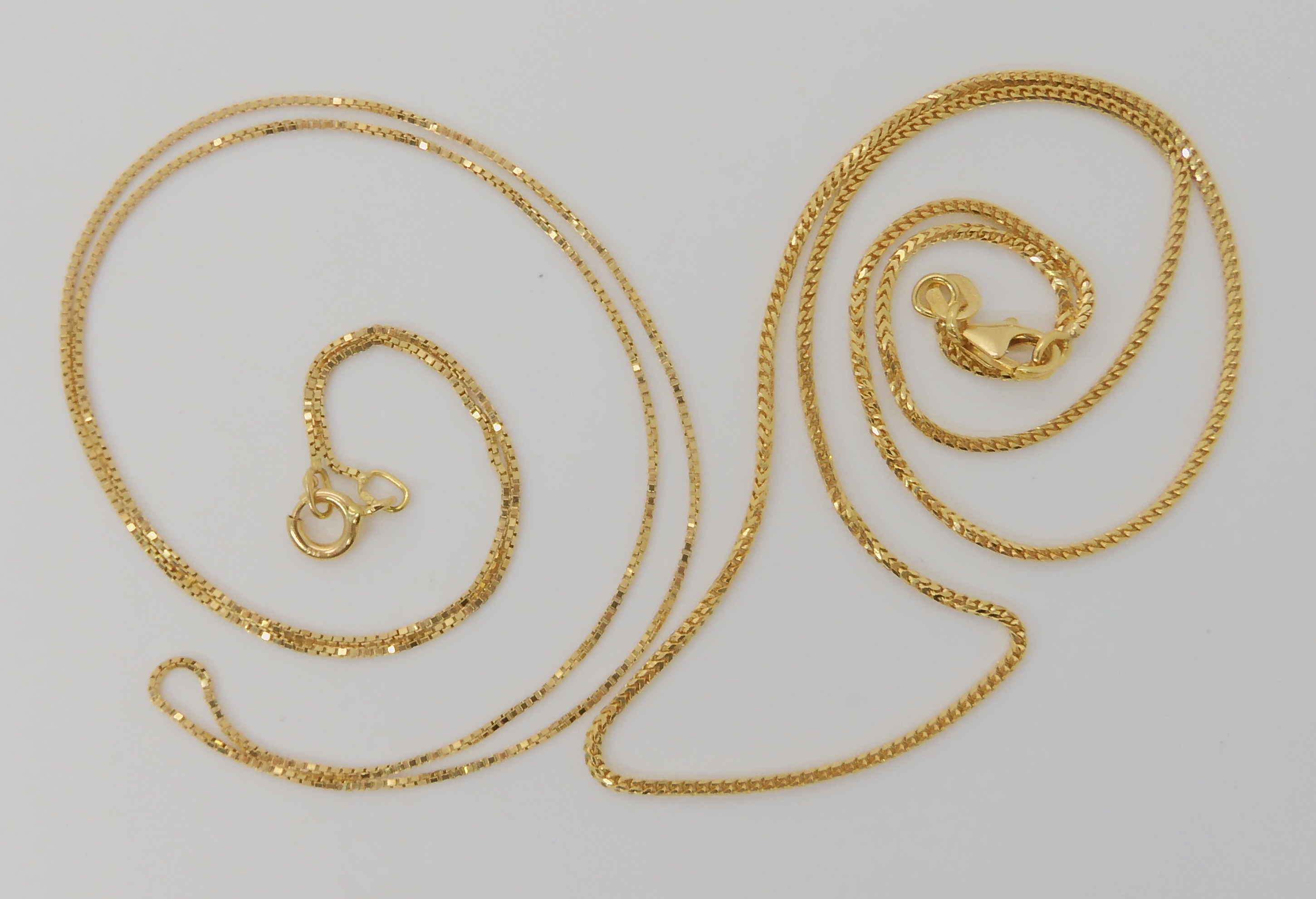 An 18ct gold box chain, length 46cm, together with a fancy 18ct herringbone chain length 40cm, - Image 2 of 2