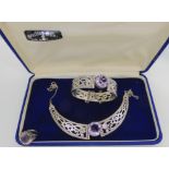 A silver Hamish Dawson Bowman suite of Celtic knotwork dragon, amethyst set jewels, comprising of