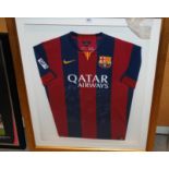 A blue and red Barcelona replica short-sleeved shirt, the front bearing numerous player